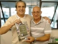 2015 - O presidente da AA Caldense, vice-campeã mineira da temporada - Laércio Otávio Martins - recebe do repórter Ailton Fonseca, da Rádio Mantiqueira FM de Poços de Caldas, o livro "100 Anos de Futebol em São João da Boa Vista", autoria de Leivinha.